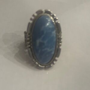 Elegant Blue and Silvertone Ring. Stretch band to fit all sizes.